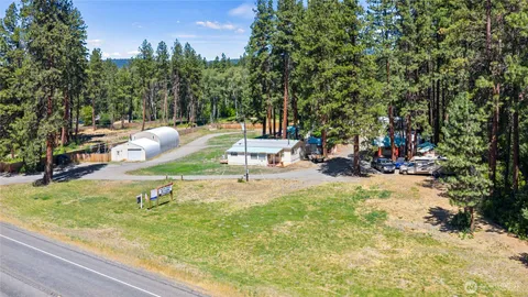 a view of a swimming pool and lounge chairs