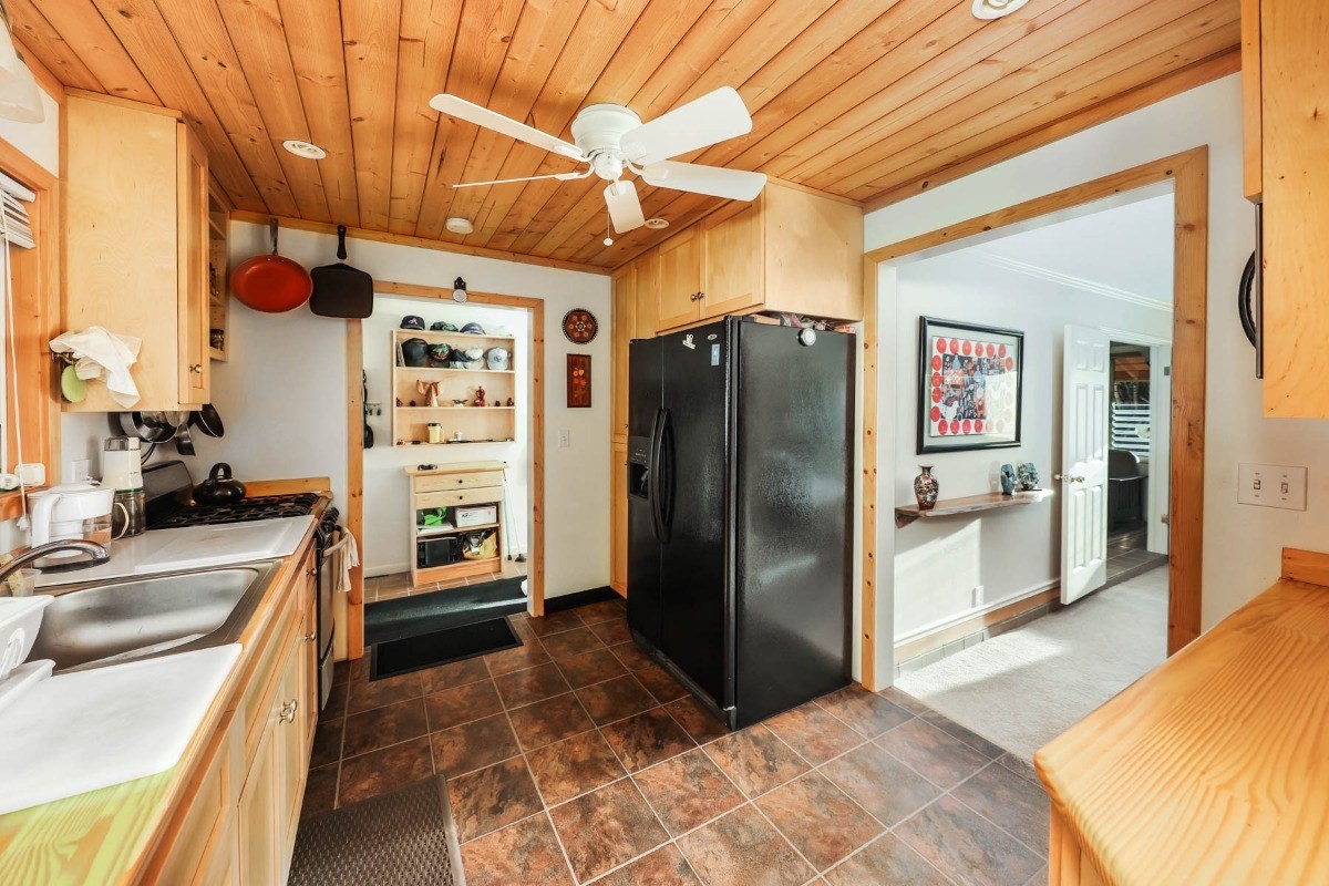1746 Hulu Road, Unit 1 Kapaa, HI 96746 - Photo 11 of 29 a kitchen with stainless steel appliances granite countertop a refrigerator and a stove