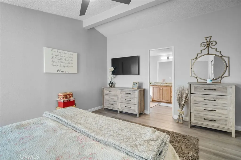 27701 Murrieta Road, Unit 37 Menifee, CA 92586 - Photo 12 of 24 a bedroom with a bed and furniture