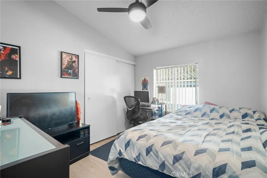 27701 Murrieta Road, Unit 37 Menifee, CA 92586 - Photo 16 of 24 a bedroom with a bed and a flat screen tv