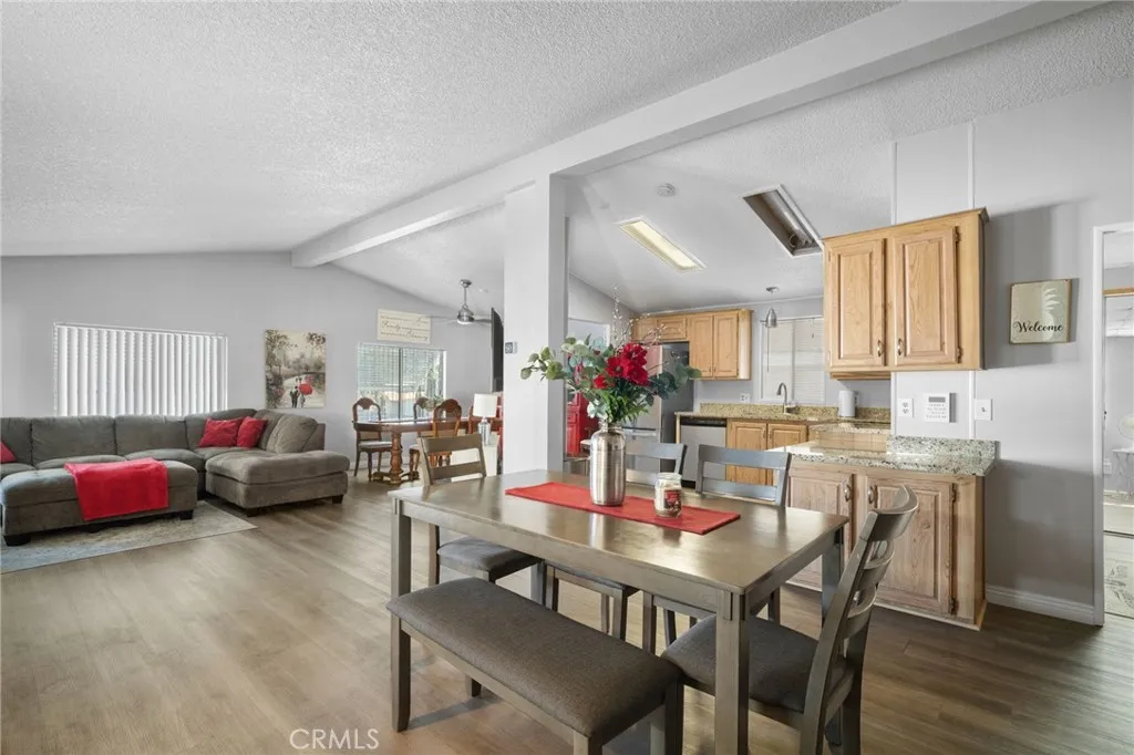 27701 Murrieta Road, Unit 37 Menifee, CA 92586 - Photo 2 of 24 a view of a dining room with furniture and wooden floor