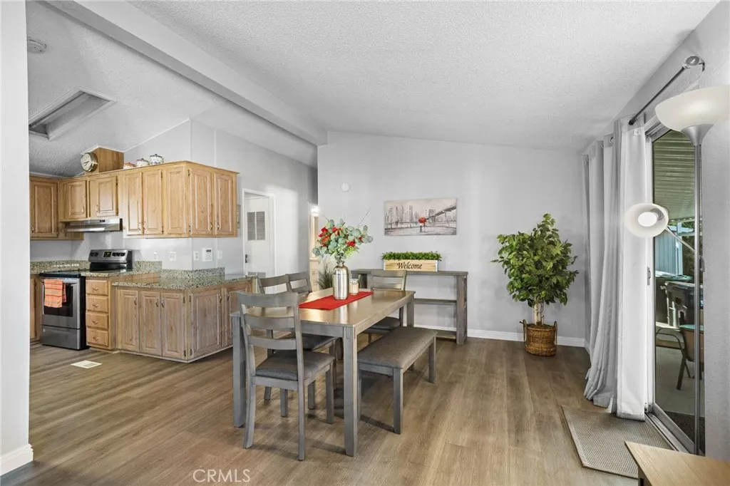 27701 Murrieta Road, Unit 37 Menifee, CA 92586 - Photo 4 of 24 a kitchen with a table and chairs in it