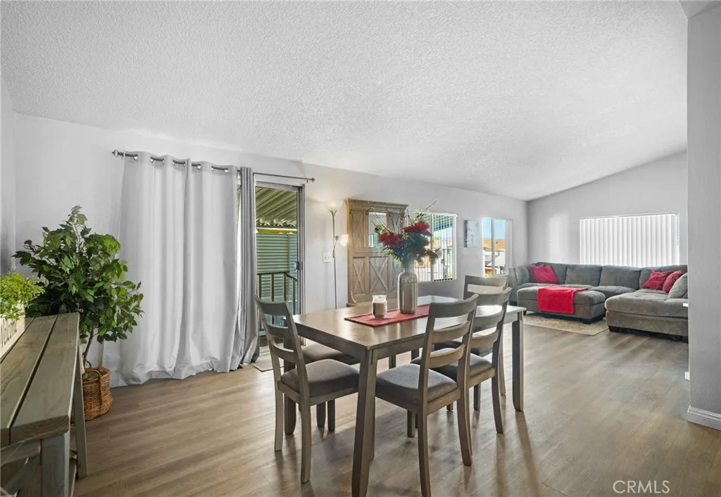 27701 Murrieta Road, Unit 37 Menifee, CA 92586 - Photo 5 of 24 a dining room with furniture and wooden floor