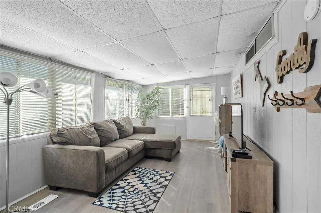 27701 Murrieta Road, Unit 37 Menifee, CA 92586 - Photo 8 of 24 a living room with furniture and a flat screen tv