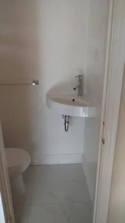 a bathroom with a sink and toilet