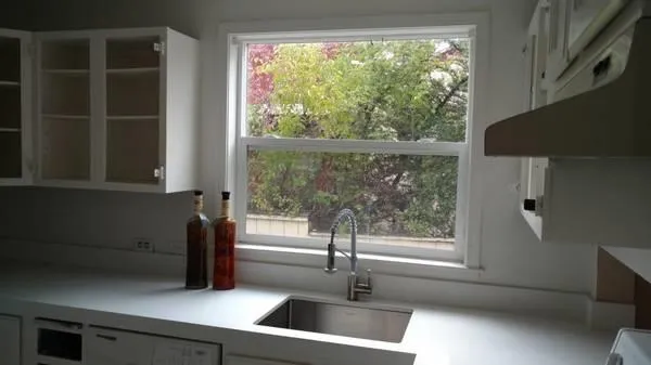 a view of a sink and a window