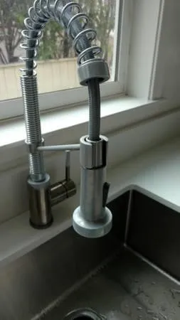 a kitchen with a sink and a stove