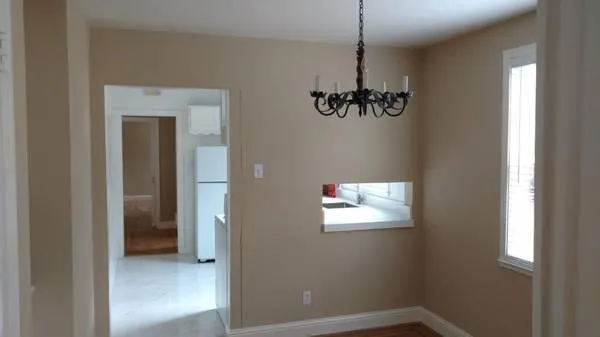 a view of a hallway with a window