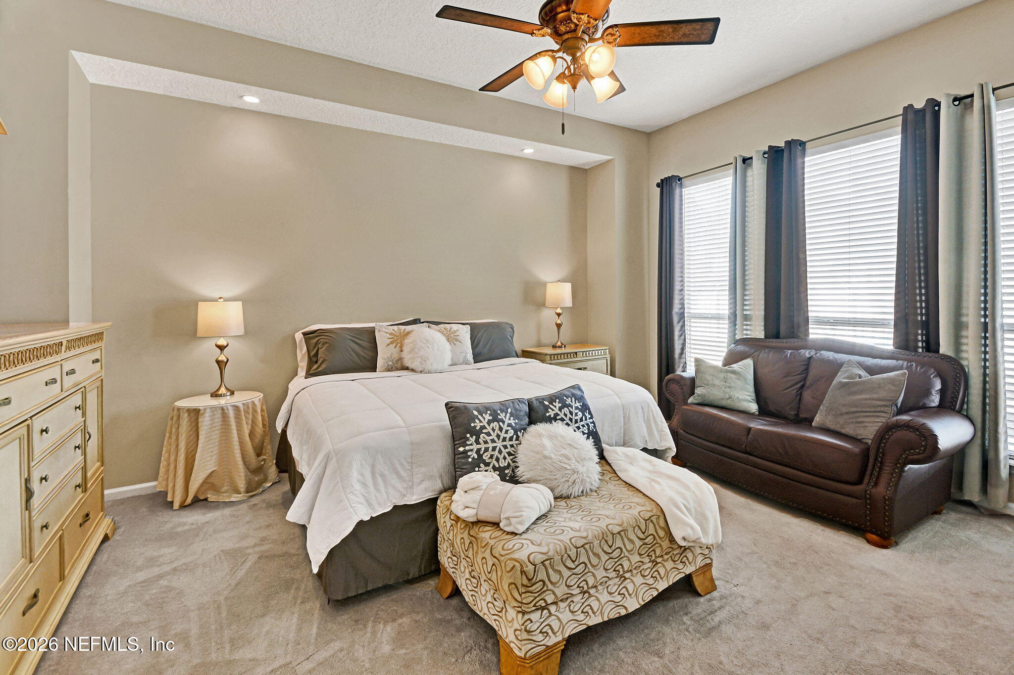 237 Twining Trace Jacksonville, FL 32259 - Photo 12 of 24 a spacious bedroom with a bed a couch and large windows