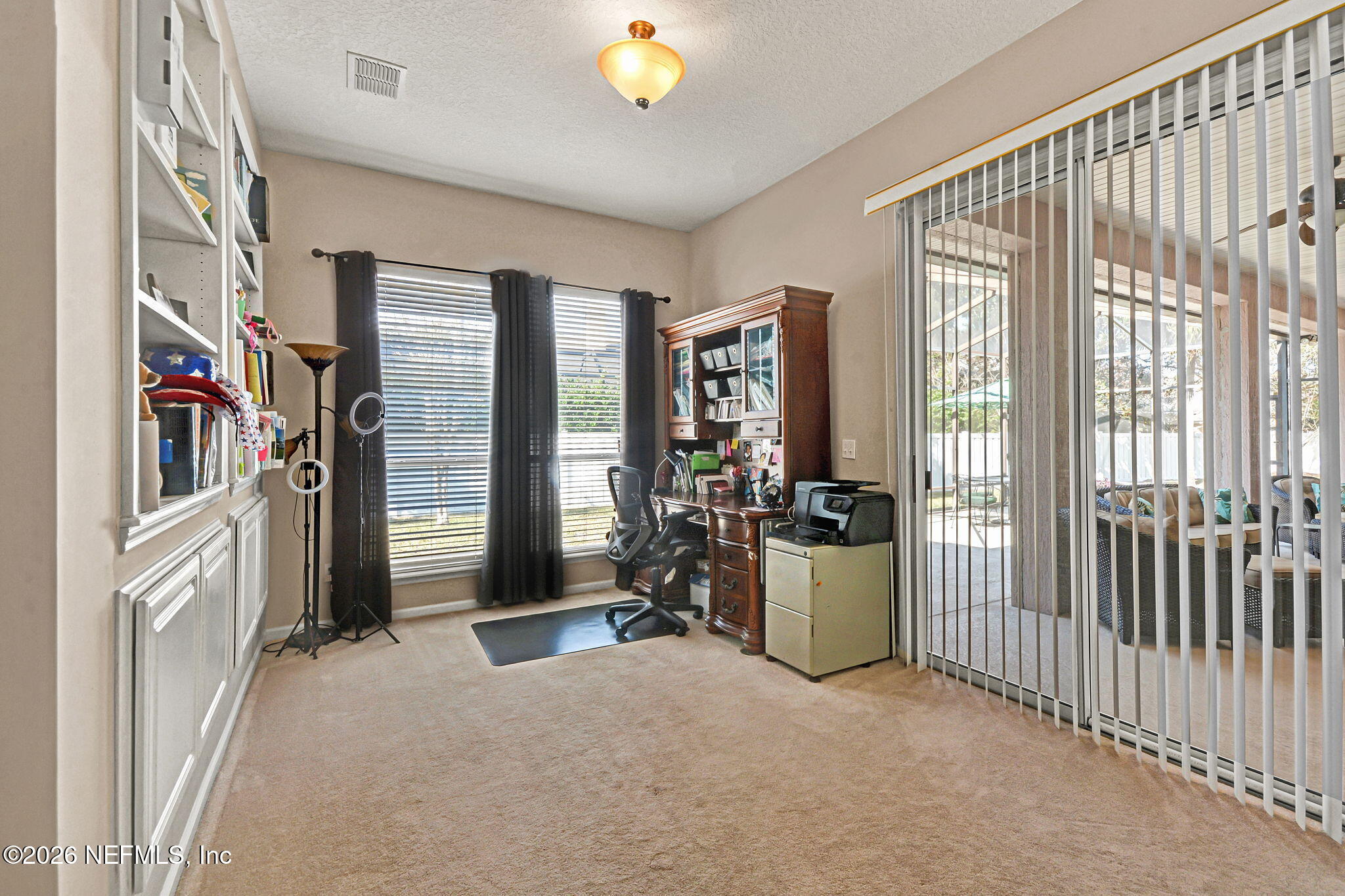 237 Twining Trace Jacksonville, FL 32259 - Photo 13 of 24 a view of a bedroom with furniture and floor to ceiling window