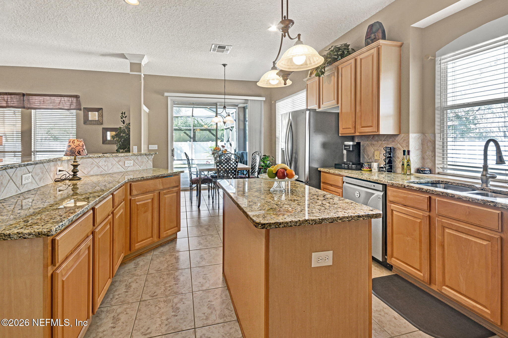 237 Twining Trace Jacksonville, FL 32259 - Photo 9 of 24 a kitchen with stainless steel appliances granite countertop a sink stove and cabinets