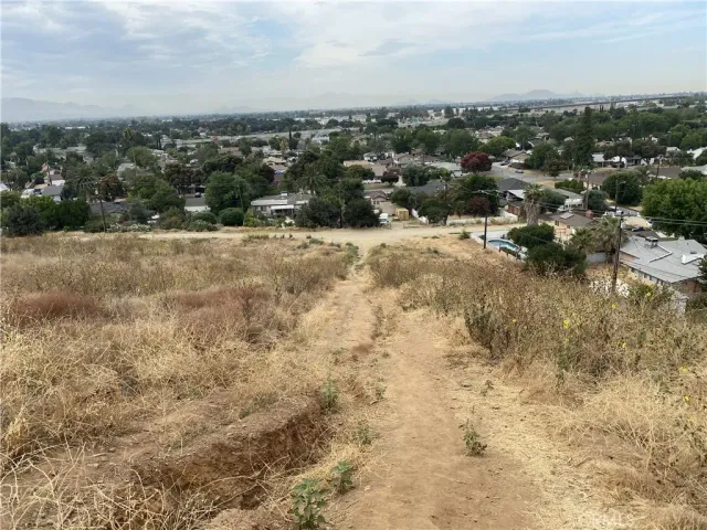 an aerial view of residential houses with city view