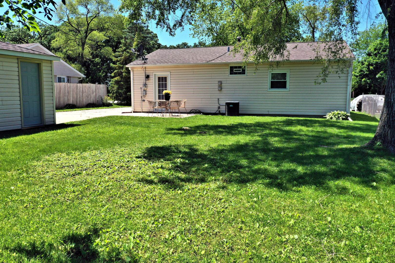 505 South Oltendorf Road Streamwood, IL 60107 - Photo 15 of 19 a view of a house with a yard and a large tree