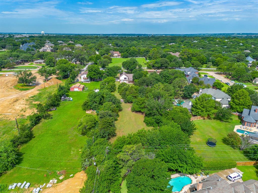 7404 John McCain Road Colleyville, TX 76034 - Photo 9 of 21 a view of a lake with houses