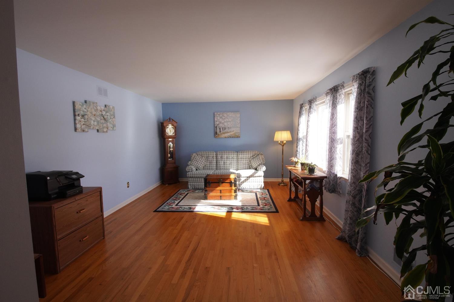 7 Markus Drive Kendall Park, NJ 08824 - Photo 16 of 47 a living room with furniture and a flat screen tv