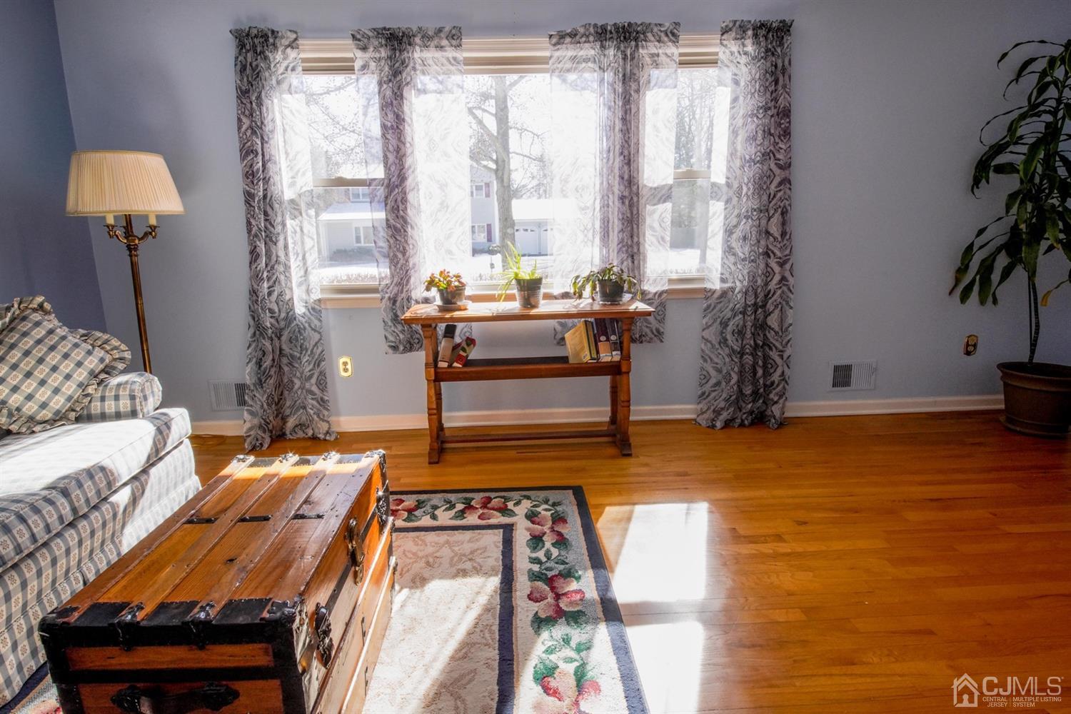7 Markus Drive Kendall Park, NJ 08824 - Photo 18 of 47 a living room with furniture and a lamp