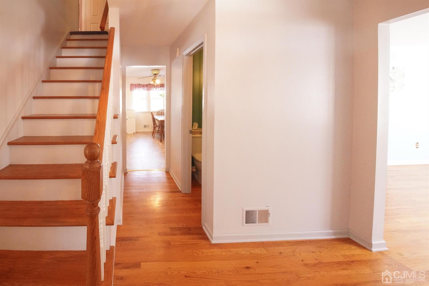 7 Markus Drive Kendall Park, NJ 08824 - Photo 21 of 47 a view of a hallway with wooden floor and entryway