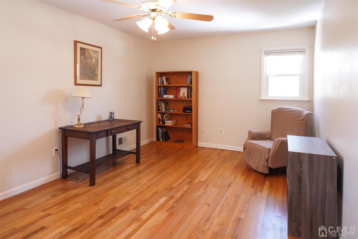 7 Markus Drive Kendall Park, NJ 08824 - Photo 26 of 47 a living room with furniture and wooden floor