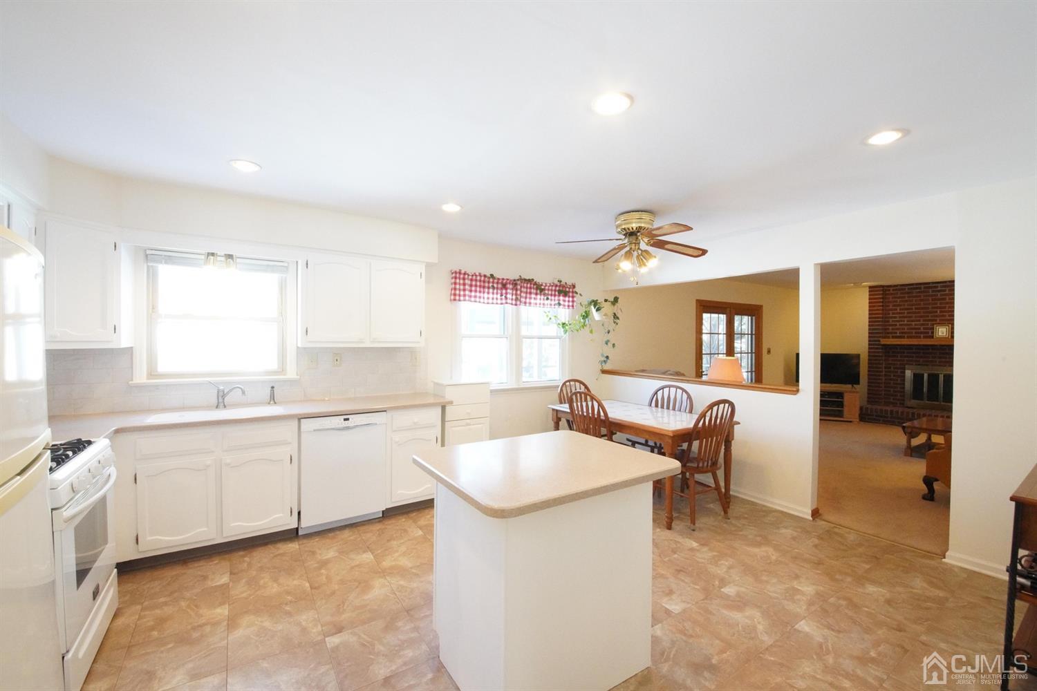 7 Markus Drive Kendall Park, NJ 08824 - Photo 37 of 47 a large kitchen with a large counter top appliances and cabinets