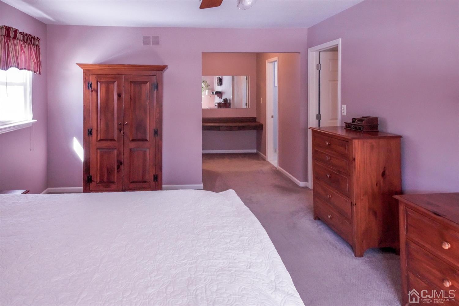 7 Markus Drive Kendall Park, NJ 08824 - Photo 44 of 47 a view of an empty room with a fireplace and a window