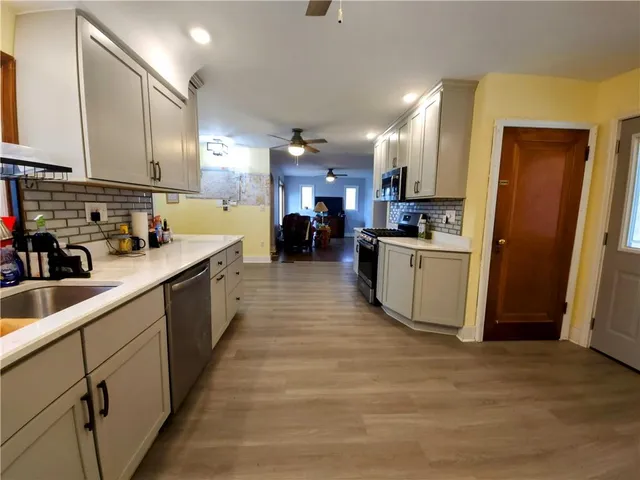 a kitchen with lots of counter top space and a sink