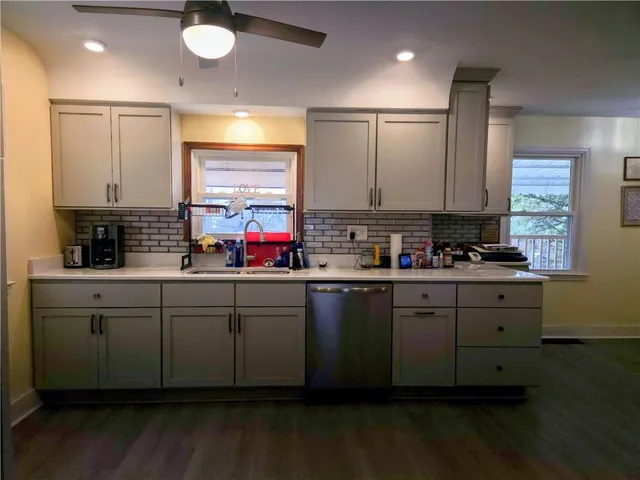 a kitchen with sink cabinets and window