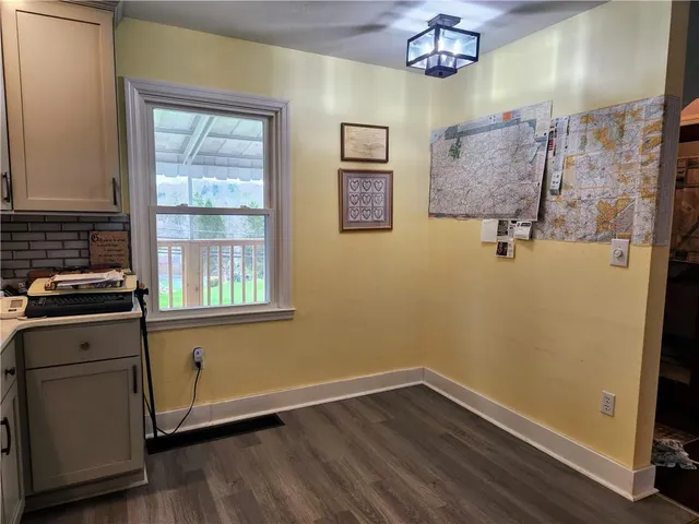 a view of storage and utility room with a window