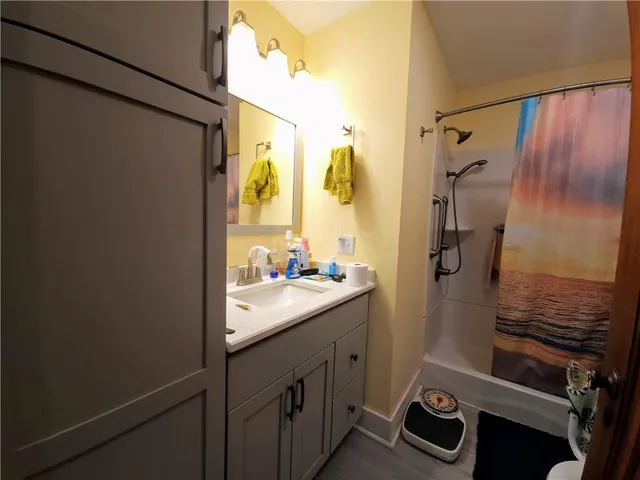 a bathroom with a sink and a mirror