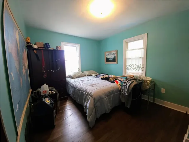 a bedroom with a bed and a closet