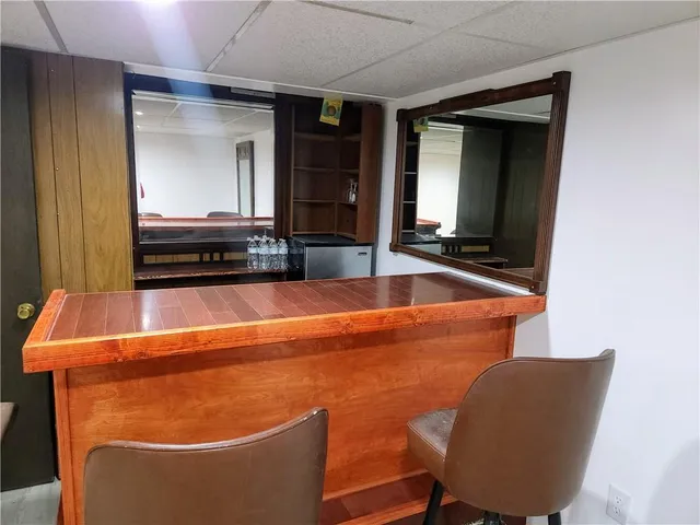 a room with wooden floor and furniture