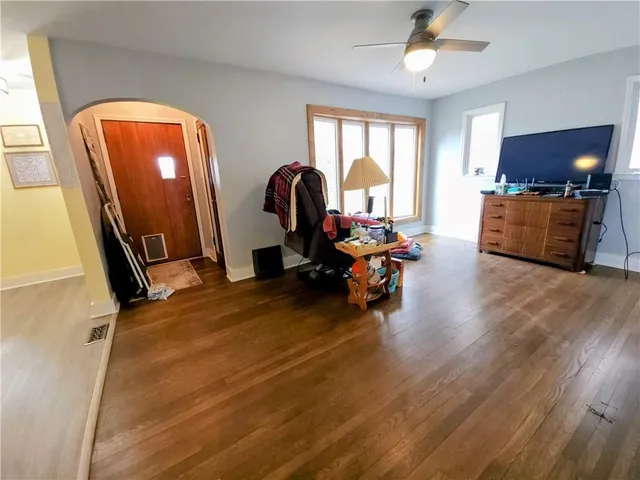a view of a livingroom with furniture and a workspace