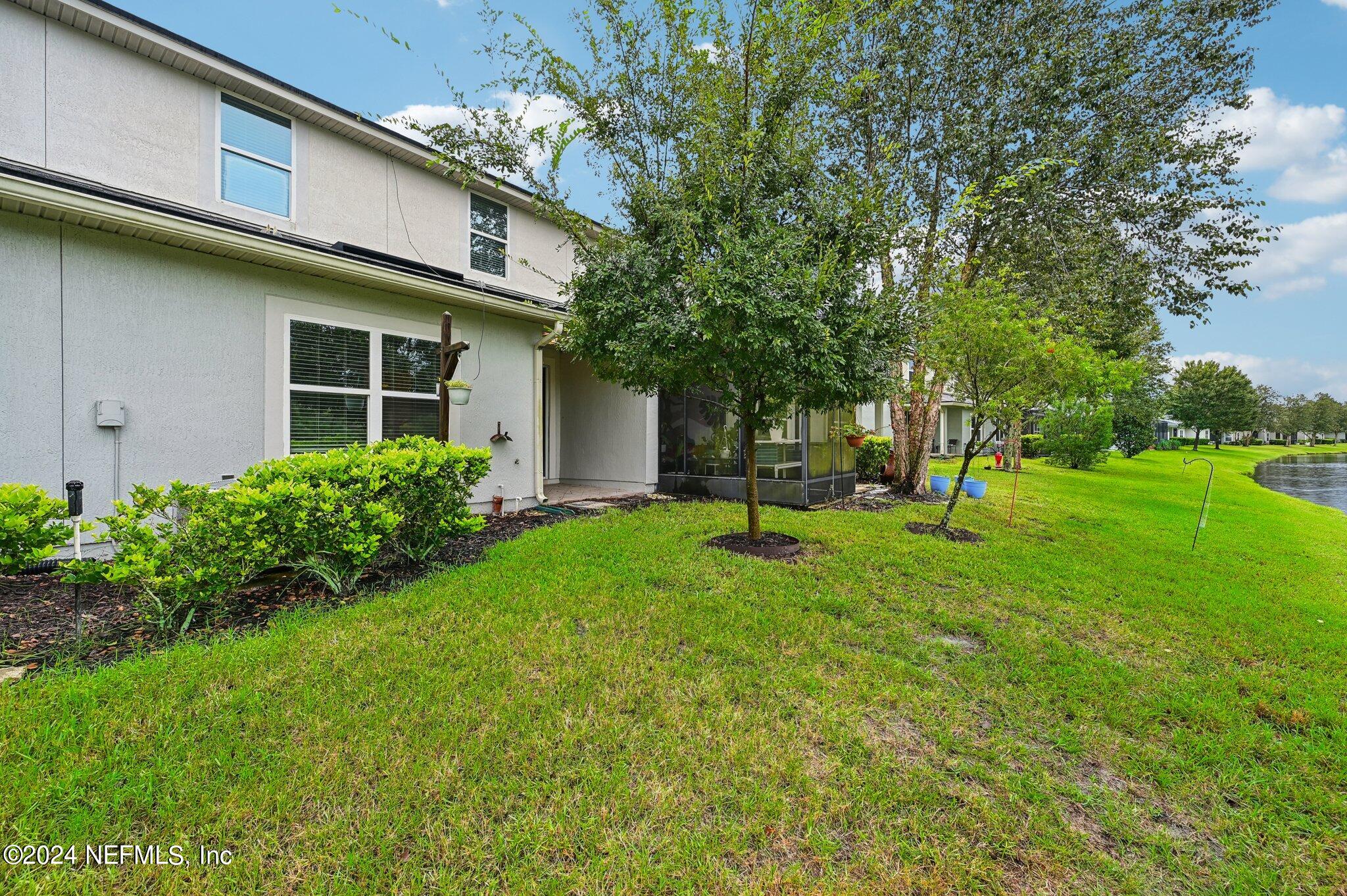165 Amistad Drive St. Augustine, FL 32086 - Photo 39 of 41 a view of a house with a backyard