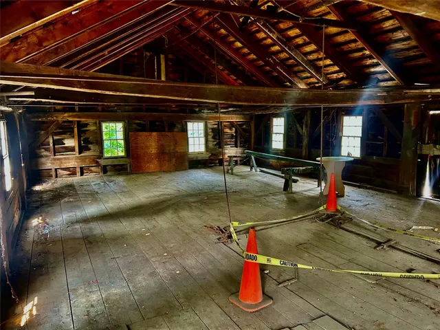 a view of a patio with table and chairs