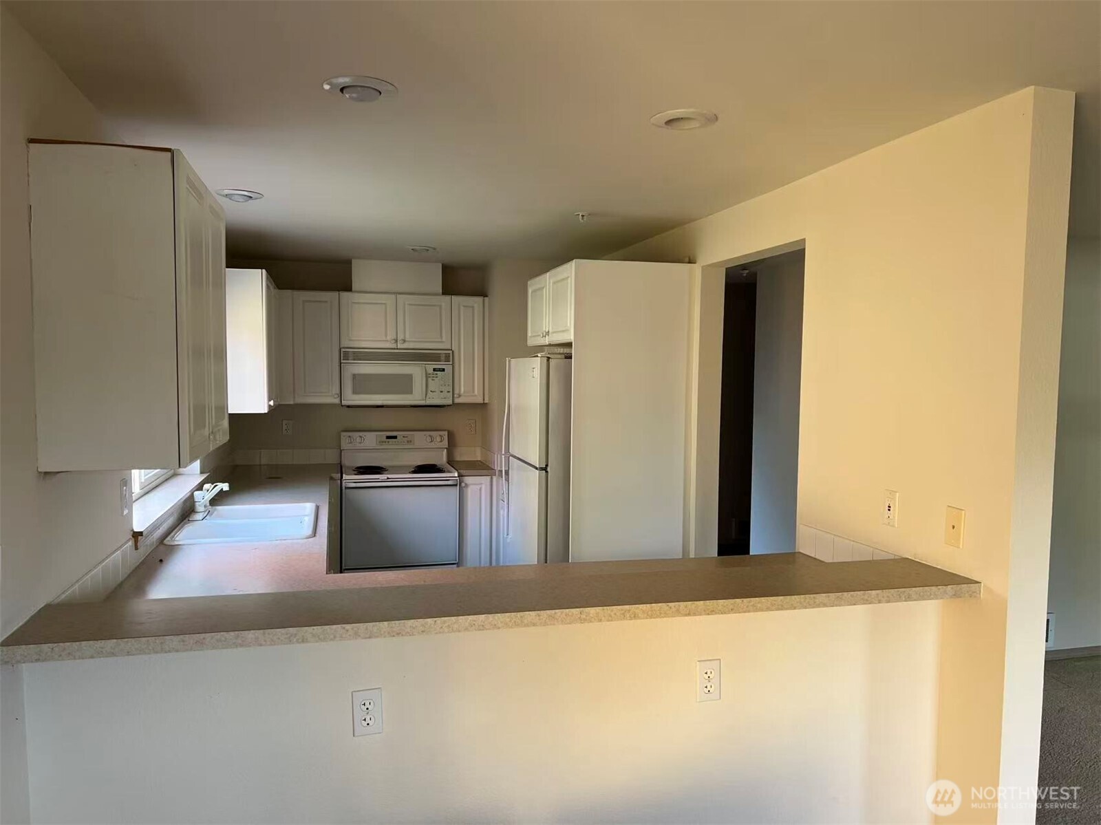 1160 Monroe Avenue Northeast, Unit D2 Renton, WA 98056 - Photo 6 of 16 a kitchen with stainless steel appliances granite countertop a refrigerator and a stove
