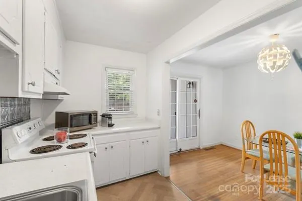 a kitchen with a sink cabinets and appliances