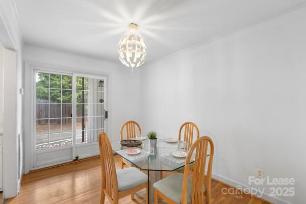 918 McAlway Road, Unit B Charlotte, NC 28211 - Photo 15 of 19 a view of a dining room with furniture and chandelier