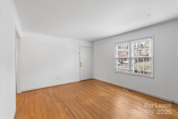 918 McAlway Road, Unit B Charlotte, NC 28211 - Photo 18 of 28 an empty room with a window