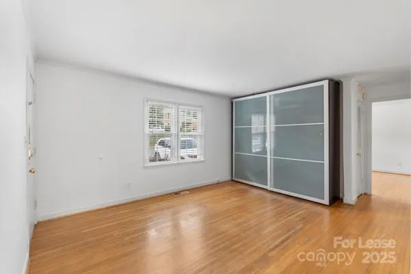 an empty room with a empty space and window