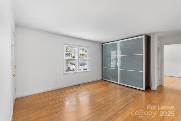 918 McAlway Road, Unit B Charlotte, NC 28211 - Photo 2 of 19 an empty room with a empty space and window