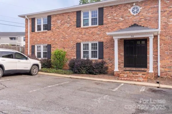 a view of a car parked in front of a building