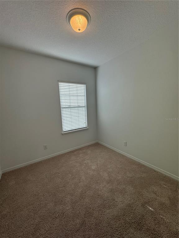 7708 Bexton Lane Windermere, FL 34786 - Photo 11 of 11 an empty room with windows