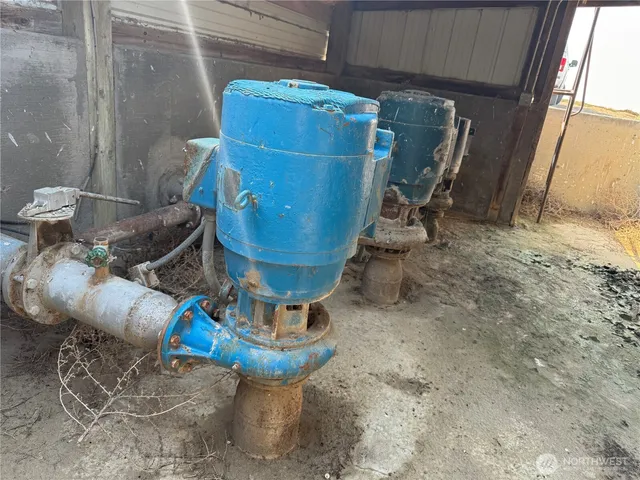 a view of a storage room with water heater and racks