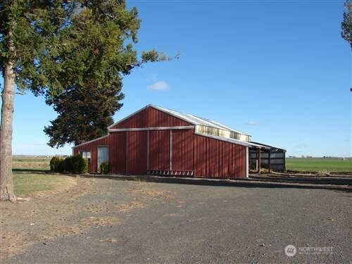 9002 Omer Road Mesa, WA 99343 - Photo 3 of 40 a view of a house with a yard