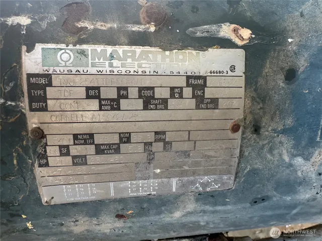 a view of a fireplace with table and chairs