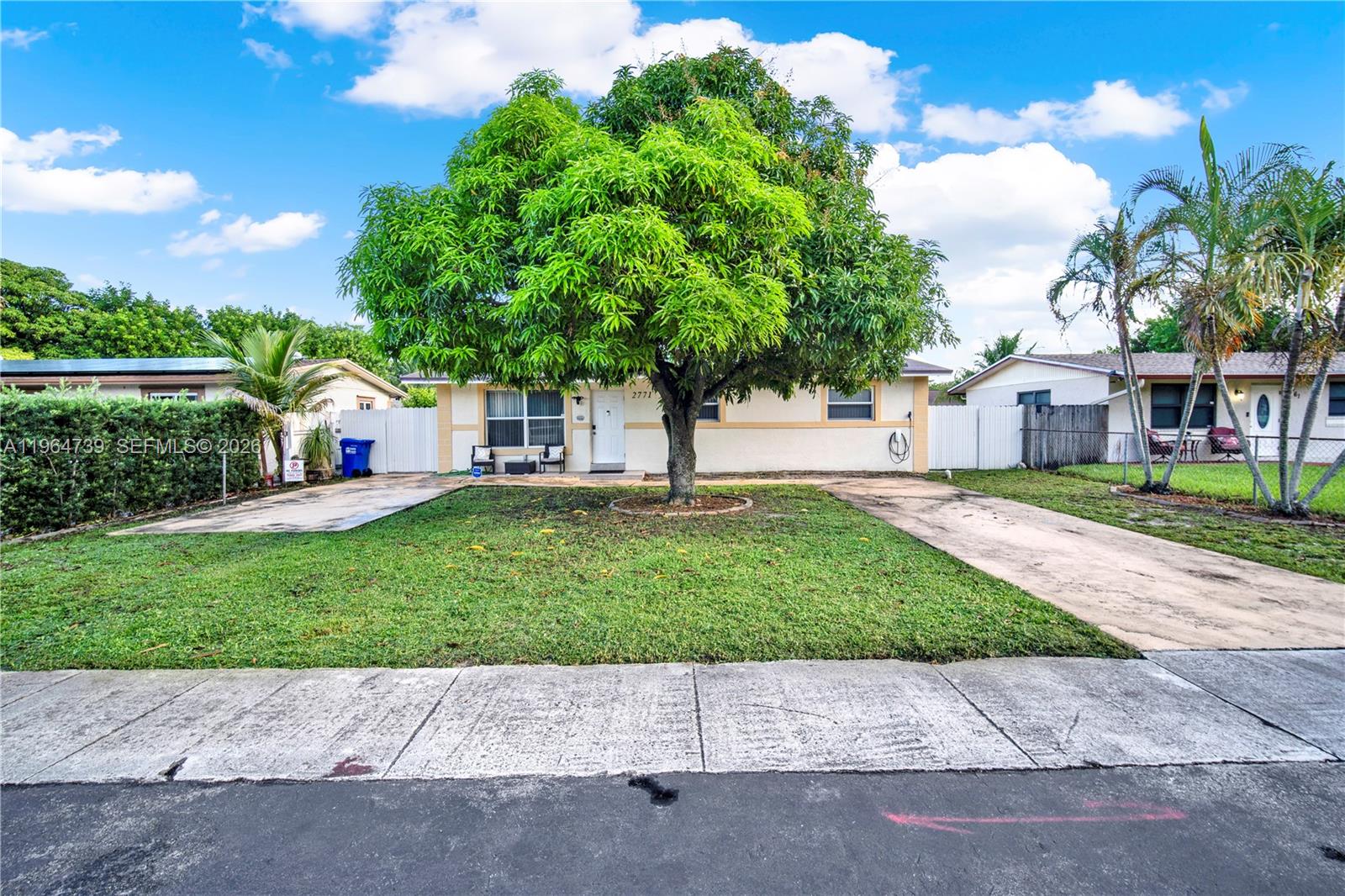 a view of street with houses in the background