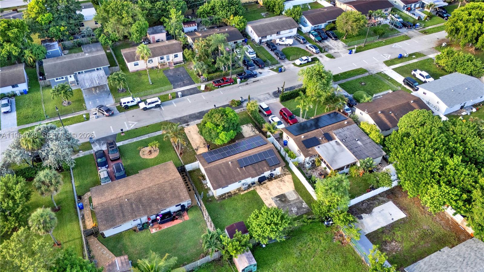 2771 Northwest 8th Street Pompano Beach, FL 33069 - Photo 27 of 27 an aerial view of a house with garden space and street view