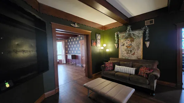 a living room with furniture and a window