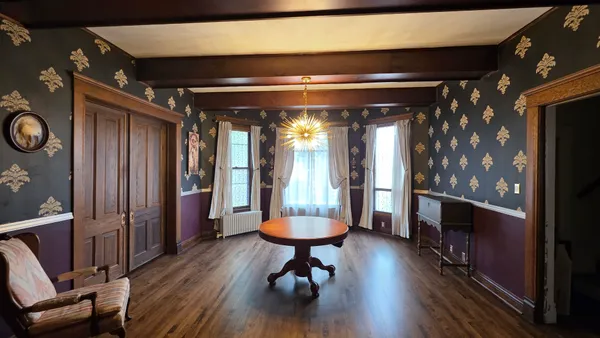 a view of a room with glass doors