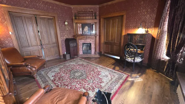 a living room with furniture rug and a fireplace