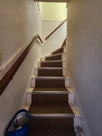 a view of a livingroom with furniture and a flat screen tv
